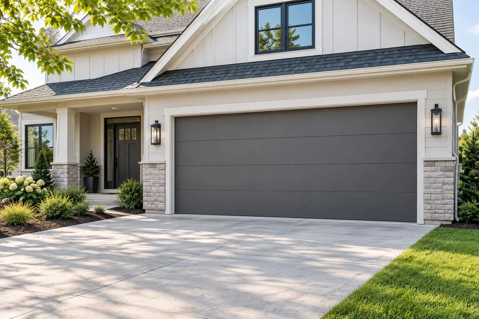 Closed flush-panel garage door beside a simple residential entrance