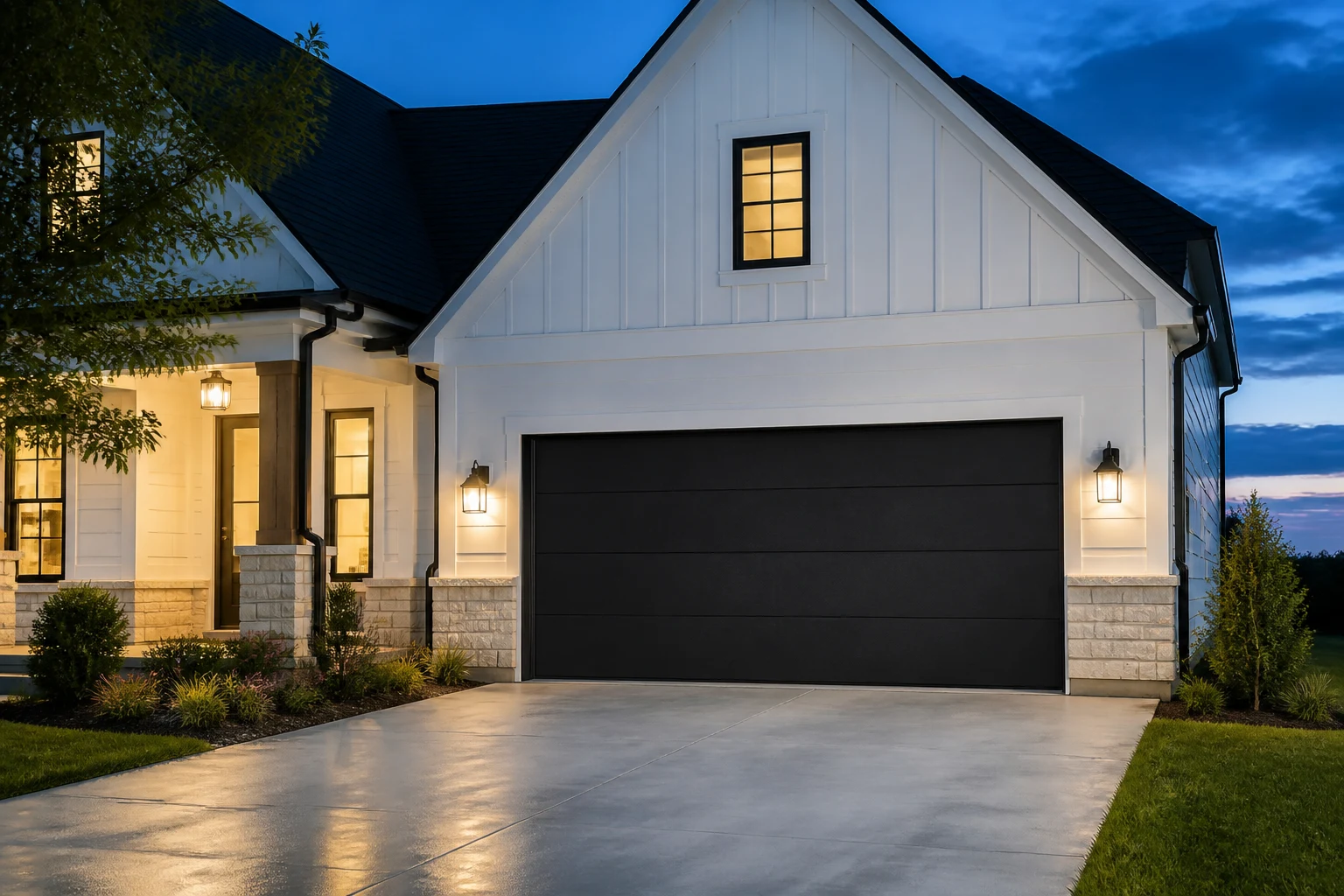 Modern black flush-panel garage door at dusk