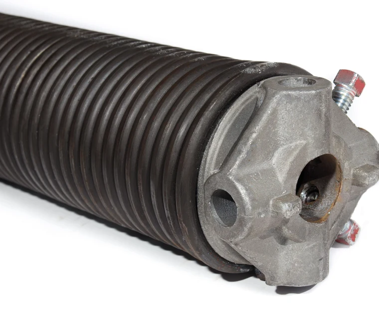 Torsion spring assembly above a garage door